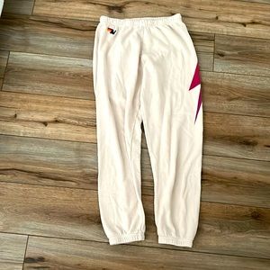 cream aviator nation sweatpants with dark pink lightning bolt